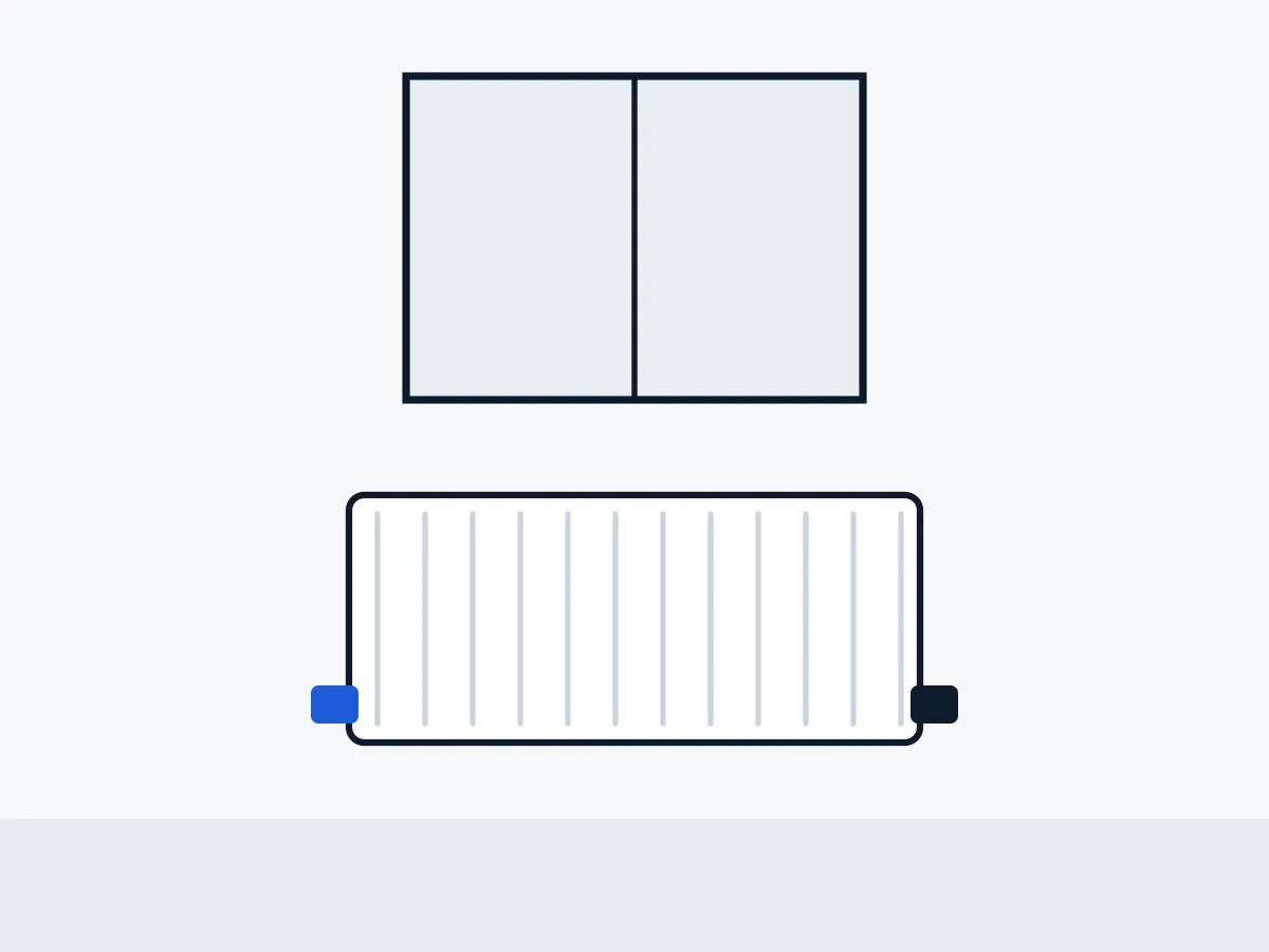 Radiator beneath a window with a thermostatic valve